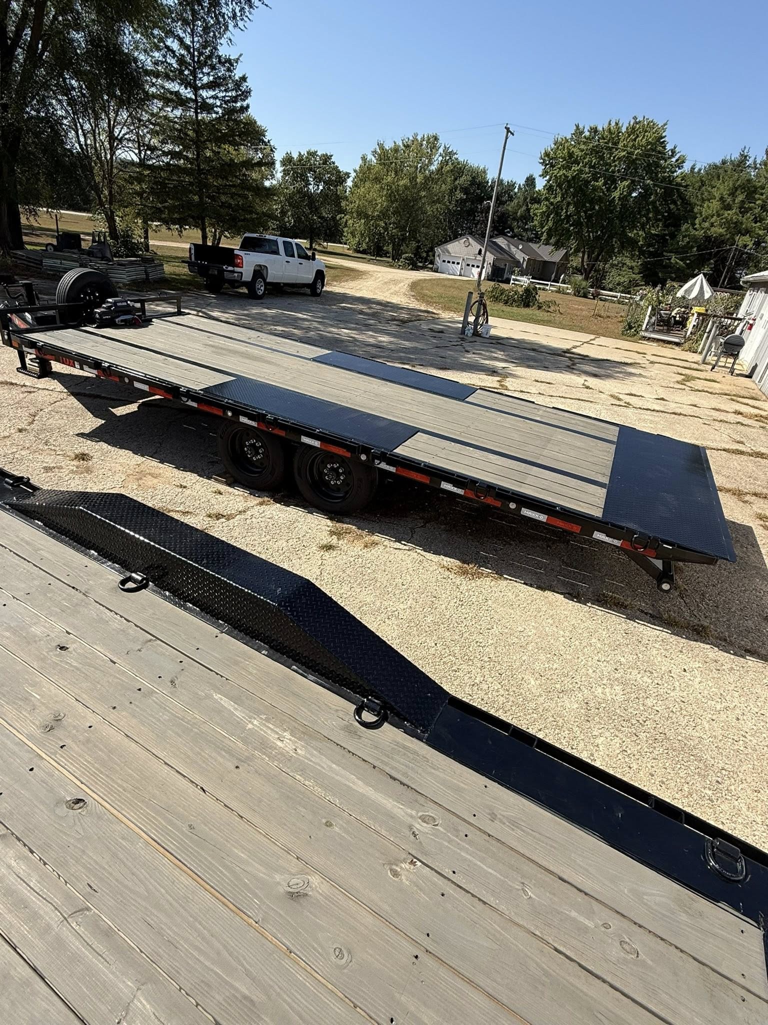 Deckover trailer for heavy equipment hauling services